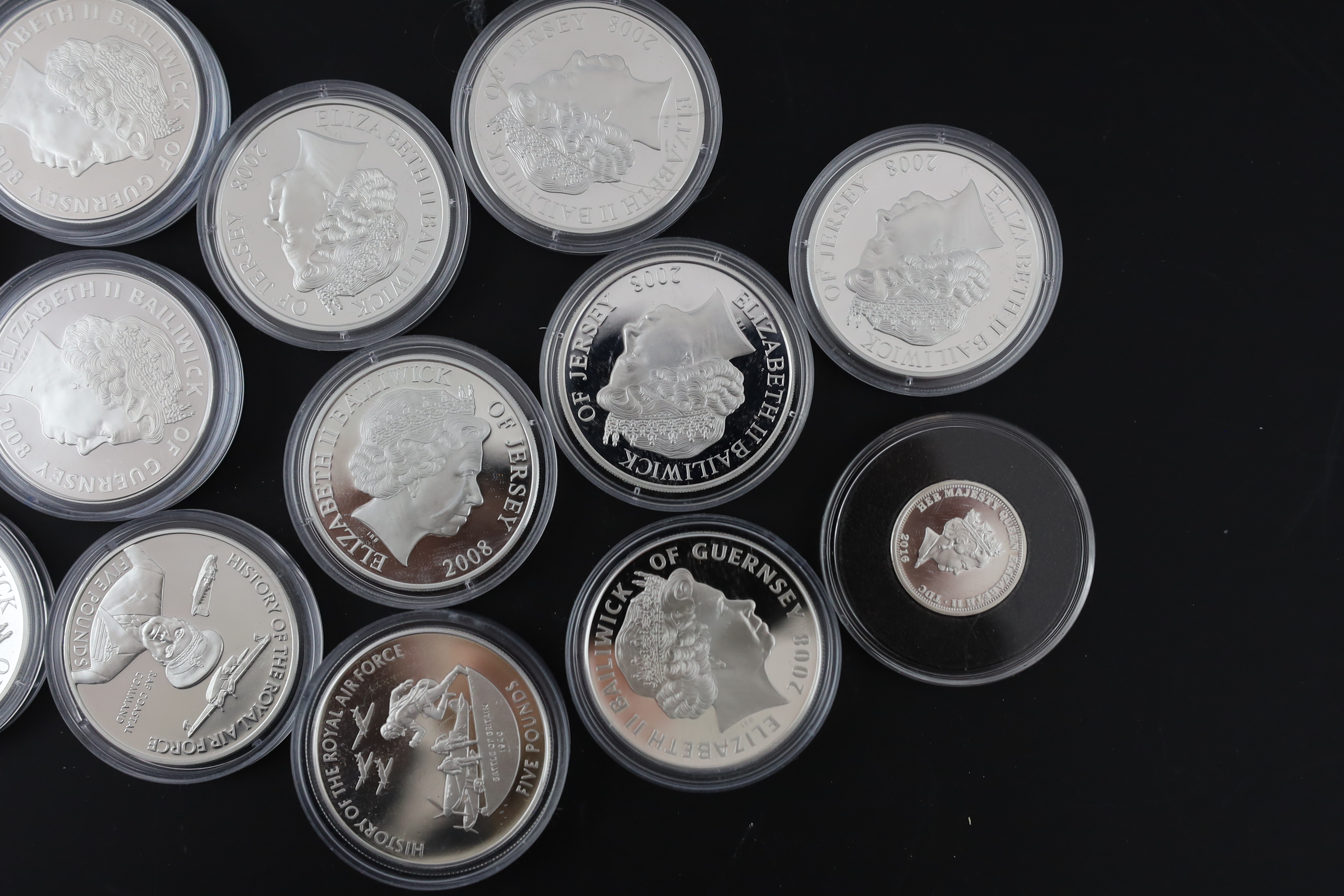 Bailiwick of Jersey and Guernsey coins, Elizabeth II, 13 History of the RAF proof silver £5 coins, 2008, a similar cupronickel coin and a Tristan da Cunha proof silver 80th anniversary Spitfire £1 coin (15)